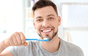 Man brushing teeth in Gainesville