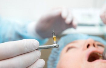 patient getting dental implants