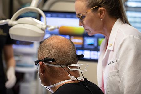 Two dentists looking at dental patient information