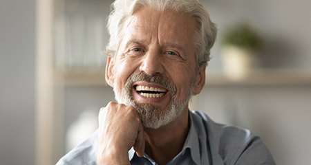 Man smiling with All-On-4 dental implants