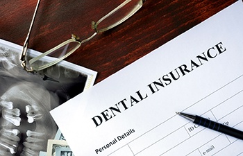 dental insurance paperwork for the cost of dental implants in Gainesville