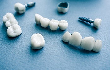 Different types of dental implants in Gainesville on blue background