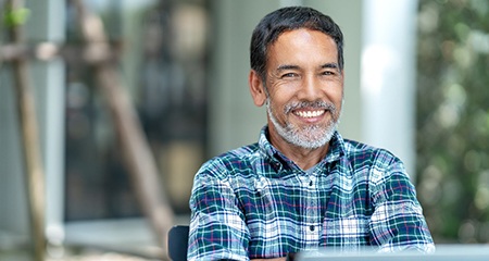 Smiling man with dentures in Gainesville 