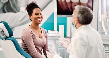 Emergency dentist in Gainesville speaking with a patient