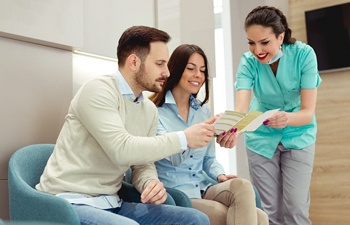 Dental staff member and patients in Gainesville