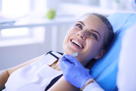 woman preparing for tooth extractions in Gainesville