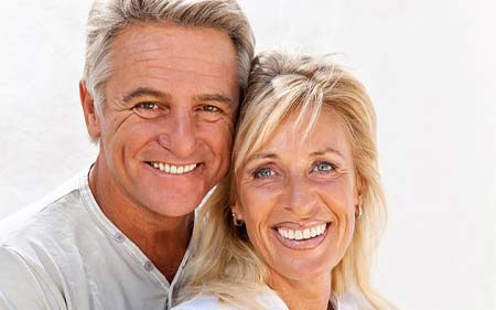 Couple after full mouth reconstruction in Gainesville