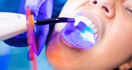 dentist showing a patient their X-rays during Invisalign consultation