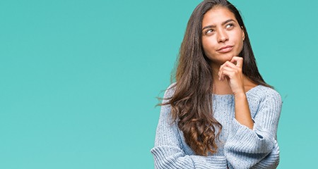 Woman wondering about Invisalign in Gainesville 