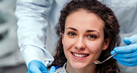 woman smiling in dental chair during I V sedation dentistry visit