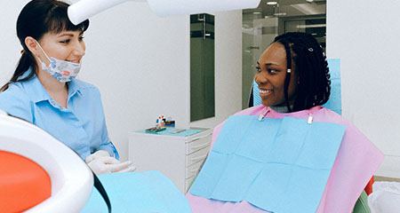 Woman having consultation with sedation dentist