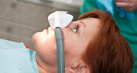 Patient with nitrous oxide sedation dentistry mask