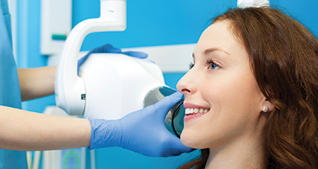 Woman receiving dental x-rays during preventive dentistry visit