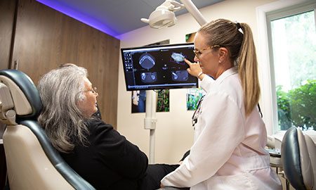 Gainesville implant dentist explaining TeethXpress to patient