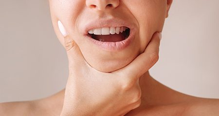 Woman with jaw pain