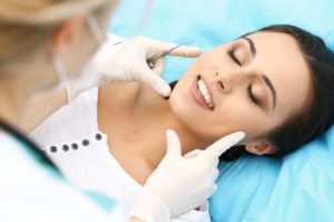 Woman at consultation with cosmetic dentist in Gainesville. 