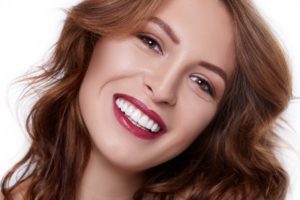 Woman with a beautiful smile using cosmetic dentistry