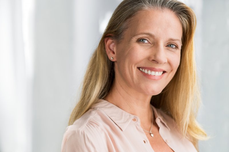 an older woman after full mouth reconstruction