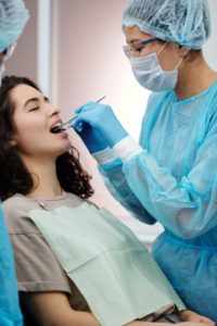 Woman in dental chair for full mouth reconstruction