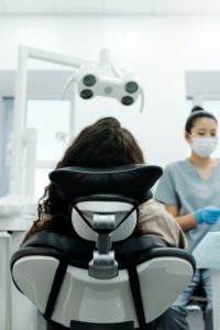 Woman in dental chair for full mouth reconstruction