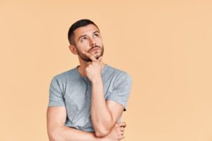 young man wondering expression