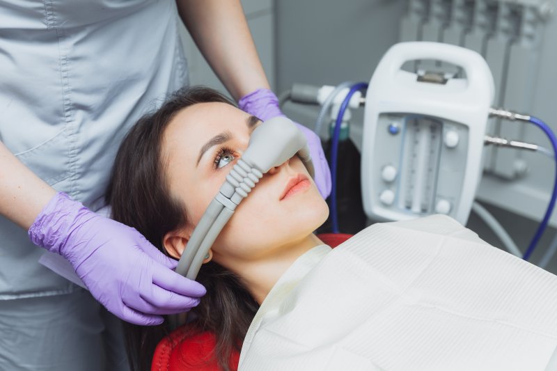 A nitrous oxide mask being applied to a patient