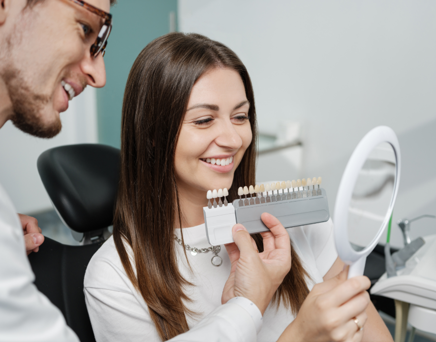 Dentist showing patient veneer options